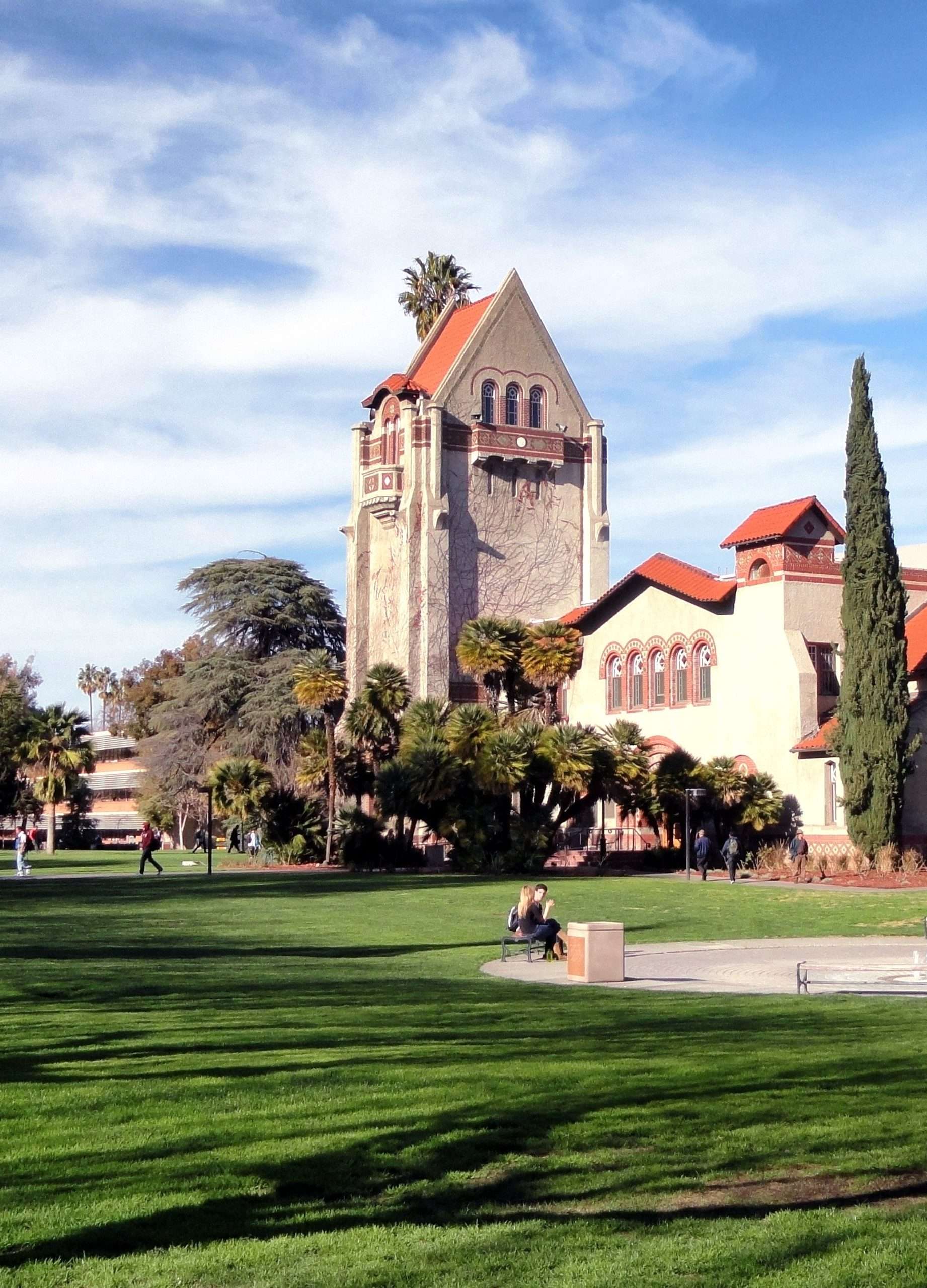a large public university with a large and clean grassy field